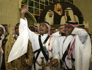 People sing celebration songs during a mass wedding ceremony in Riyadh June 24, 2008. A...